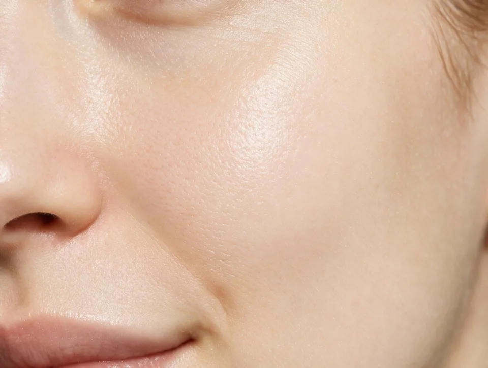 Macro close-up of healthy cheek skin with visible natural pores